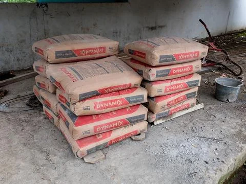 Stack of cement sacks at a construction site Foto stock