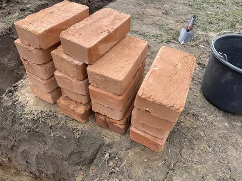 Stack of ceramic bricks arranged on the ground Stock Photos
