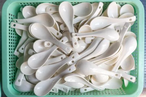Stack of ceramic spoons for soup 스톡 사진