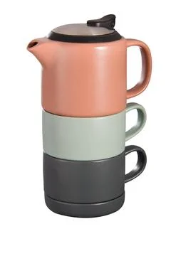 Stack of Ceramic Teapot and Cups on White Background Foto stock