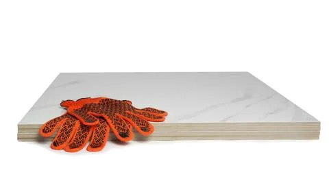 Stack of ceramic tiles and gloves on white background 스톡 사진