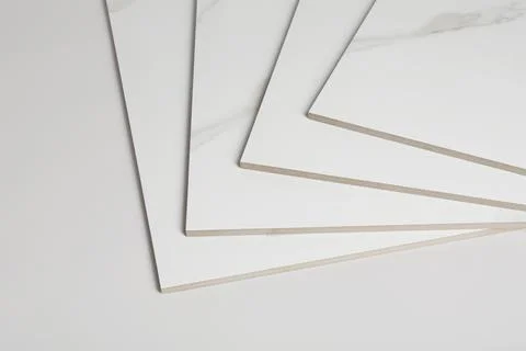 Stack of ceramic tiles on white background. Space for text 스톡 사진