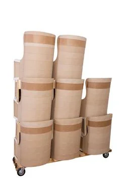 A stack of chair bodies on a trolley is prepared for moving to the upholstery Фото