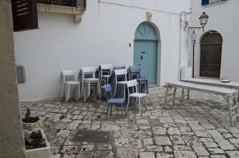 Stack of chairs in Italian square 스톡 사진