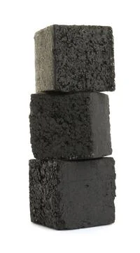 Stack of charcoal cubes for hookah on white background Stockfoto's
