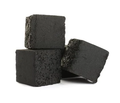 Stack of charcoal cubes for hookah on white background Stockfoto's