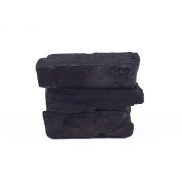 Stack of charcoal isolated on white Stock Photos
