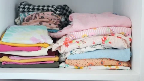 Stack child cloths on a shelf. Stock Footage 260593120