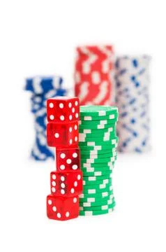 Stack of chips and dice isolated on the white background Stock Photos
