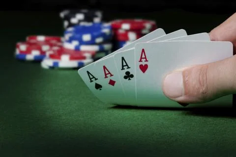 Stack of chips and four aces Stock Photos