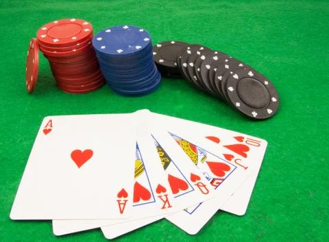 Stack of chips and a royal flush Stock Photos