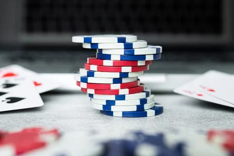 Stack chips poker on a table background Stock Photos
