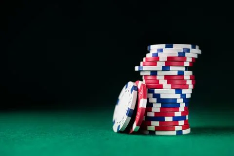 Stack chips poker on a table background Stock Photos