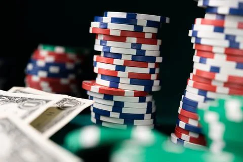 Stack chips poker on a table background Stock Photos