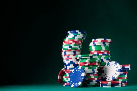 Stack chips poker on a table background Stock Photos