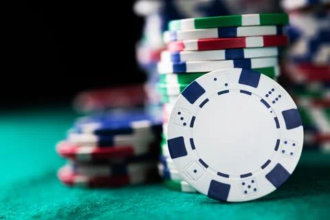Stack chips poker on a table background Stock Photos