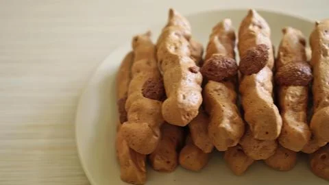 Stack of chocolate and vanilla cookies on a white plate 스톡 사진