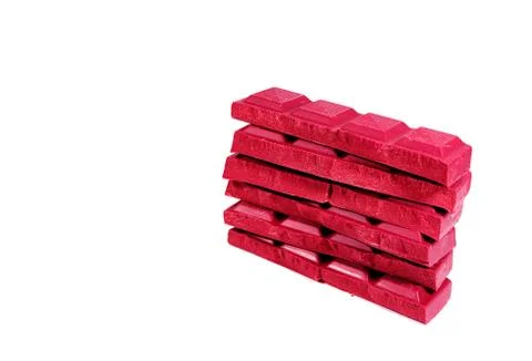 Stack of Chocolate Bars in Ruby Red Colored Isolated on White Background Stock Photos