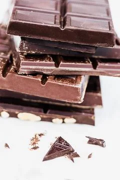 Stack of chocolate bars on white background for dessert concepts Stock Photos