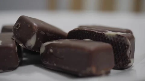 A stack of chocolate candies on the table Video stock 254166216