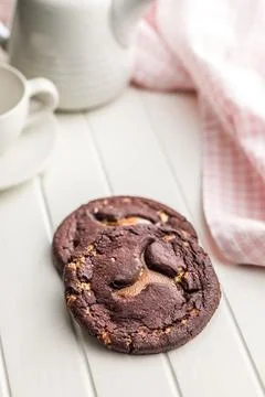 Stack Of Chocolate Caramel Cookies Close-Up On White Table With Coffee Cup .. 스톡 사진