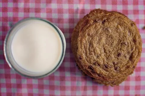 Stack of chocolate chip cookies and milk Stock Photos