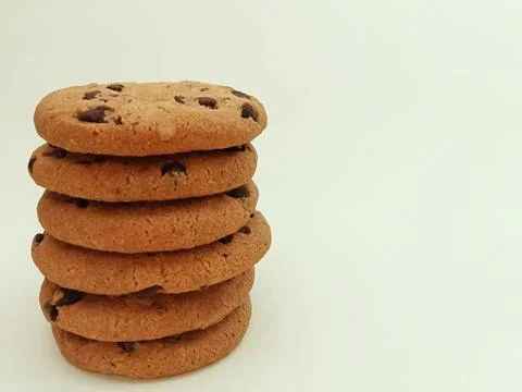 Stack of chocolate chip cookies isolated on light background Stock Photos