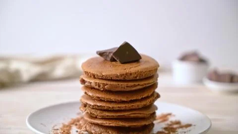 Stack of chocolate chip cookies on a white plate 스톡 사진