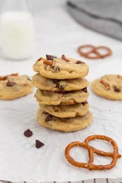 Stack of Chocolate Chip Pretzel Cookies with glass of milk Stock Photos