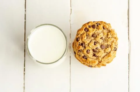 Stack of chocolate chips cookies with milk. Top view, close up. Stock Photos