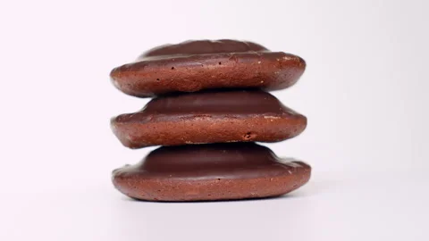 Stack of Chocolate-Coated Cookies on White Background Stock Footage 286831553