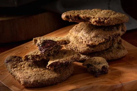 A stack of chocolate cookies on the wooden table. Selective focus. Stock Photos