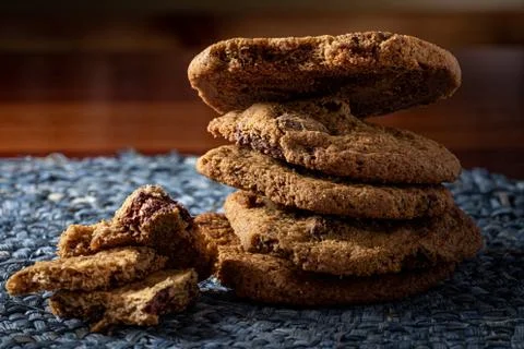 A stack of chocolate cookies on the wooden table. Selective focus. Stock Photos