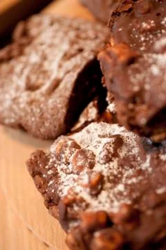 A stack of chocolate covered Marshmallow Rocky Roads on a Cafe style counter Stock Photos