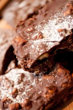 A stack of chocolate covered Marshmallow Rocky Roads on a Cafe style counter Stock Photos