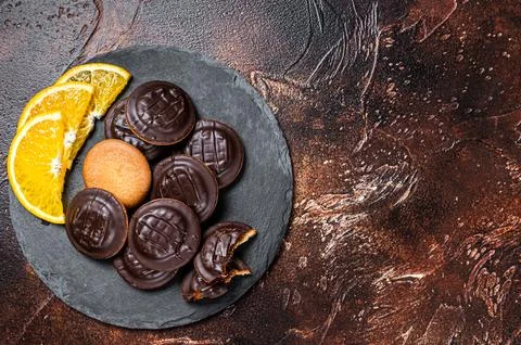 Stack of Chocolate Covered Round Jaffa Cookies with Orange Flavored Marmala.. Stockfoto's