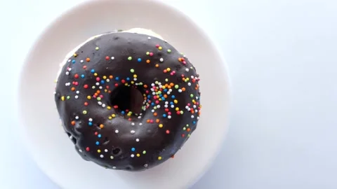 Stack of chocolate donuts on plate with copy space Stock Footage 141805917