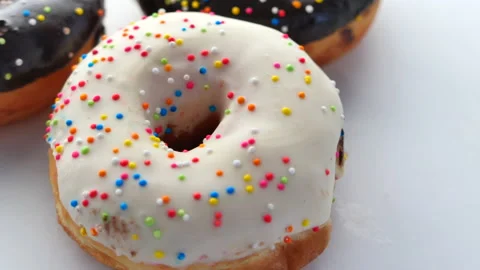 Stack of chocolate donuts on plate with copy space Stock Footage 144011931