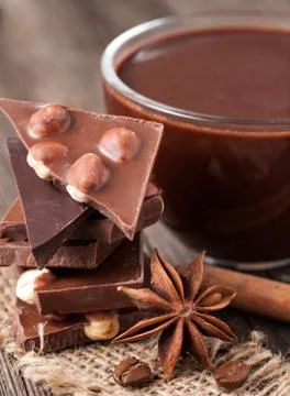 Stack of chocolate with nuts cinnamon and coffee Stock Photos