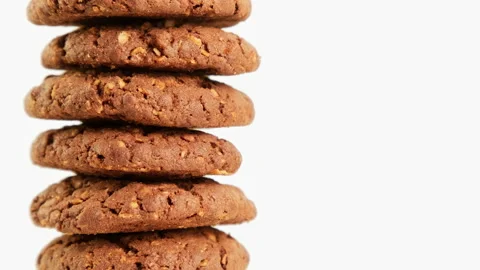 Stack of chocolate oatmeal cookies rotating on white background. Food concept Stock Footage 219308469