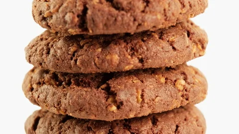 Stack of chocolate oatmeal cookies rotating on white background. Homemade cookie Stock Footage 234127659