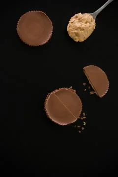Stack of chocolate peanut butter cup on black background. Stock Photos