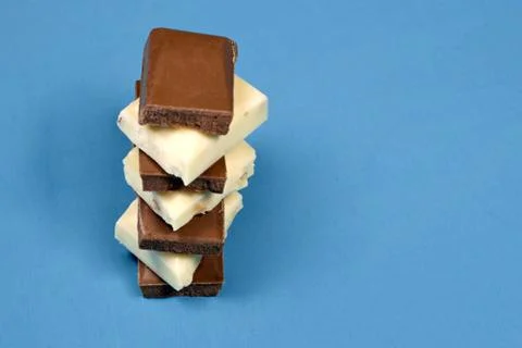 Stack of chocolate pieces brown and white. Stock Photos