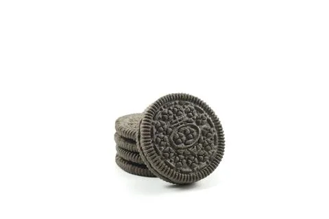 Stack of chocolate sandwich biscuits with delicious vanilla cream Stock Photos