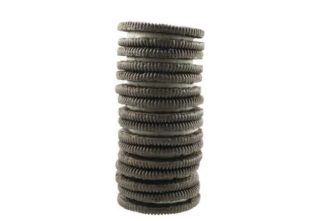 Stack of chocolate sandwich biscuits with delicious vanilla cream Stock Photos