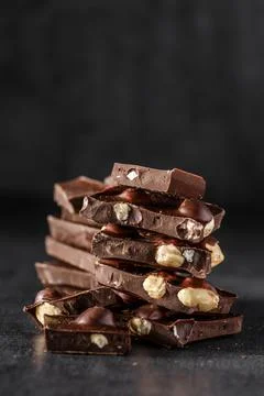 Stack of chocolate slices with mint leaf.Hazelnut and almond milk and dark ch Foto stock