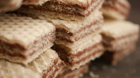 Stack of chocolate wafer cookies rotating slowly in close up shot with macr.. Stock Footage 331719518
