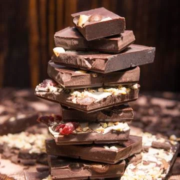 Stack of chocolate on a wooden background Stock Photos