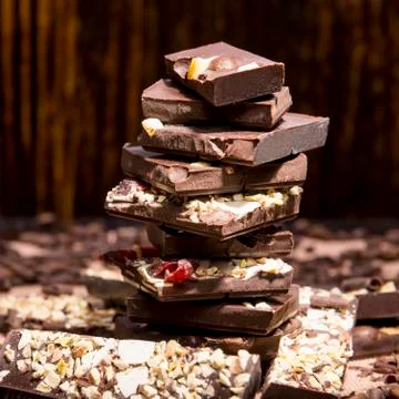 Stack of chocolate on a wooden background Stock Photos