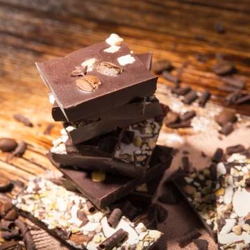 Stack of chocolate on a wooden background Stock Photos